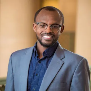 Headshot of Aristide Gumyusenge